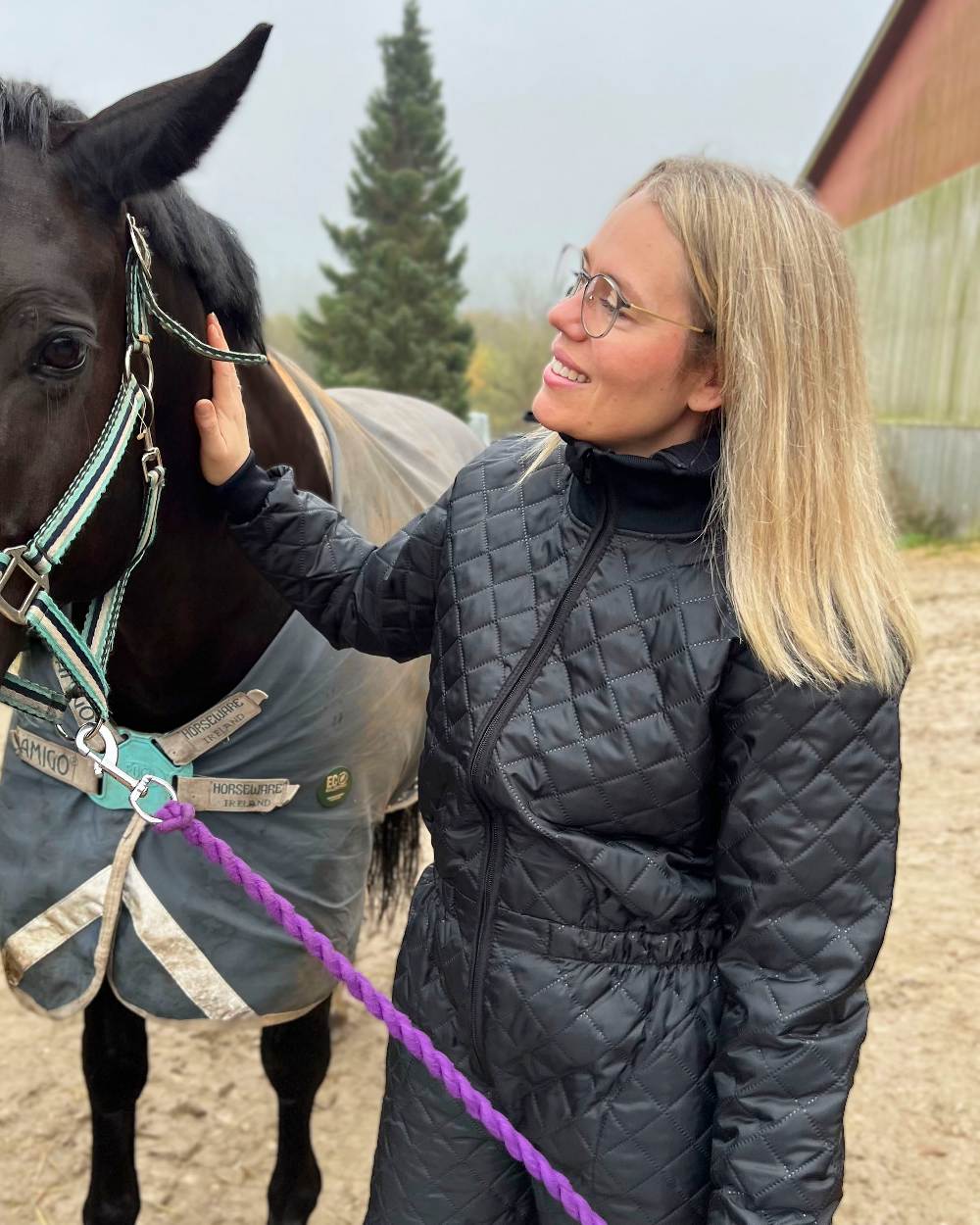 Black Coloured Elka Womens Thermal Coverall on countryside background 