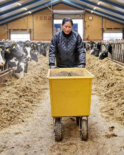 Black Coloured Elka Womens Thermal Jacket on barn background 