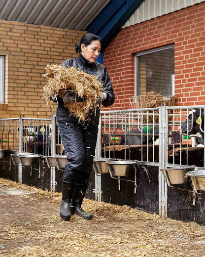 Black Coloured Elka Womens Thermal Trousers on barn background 