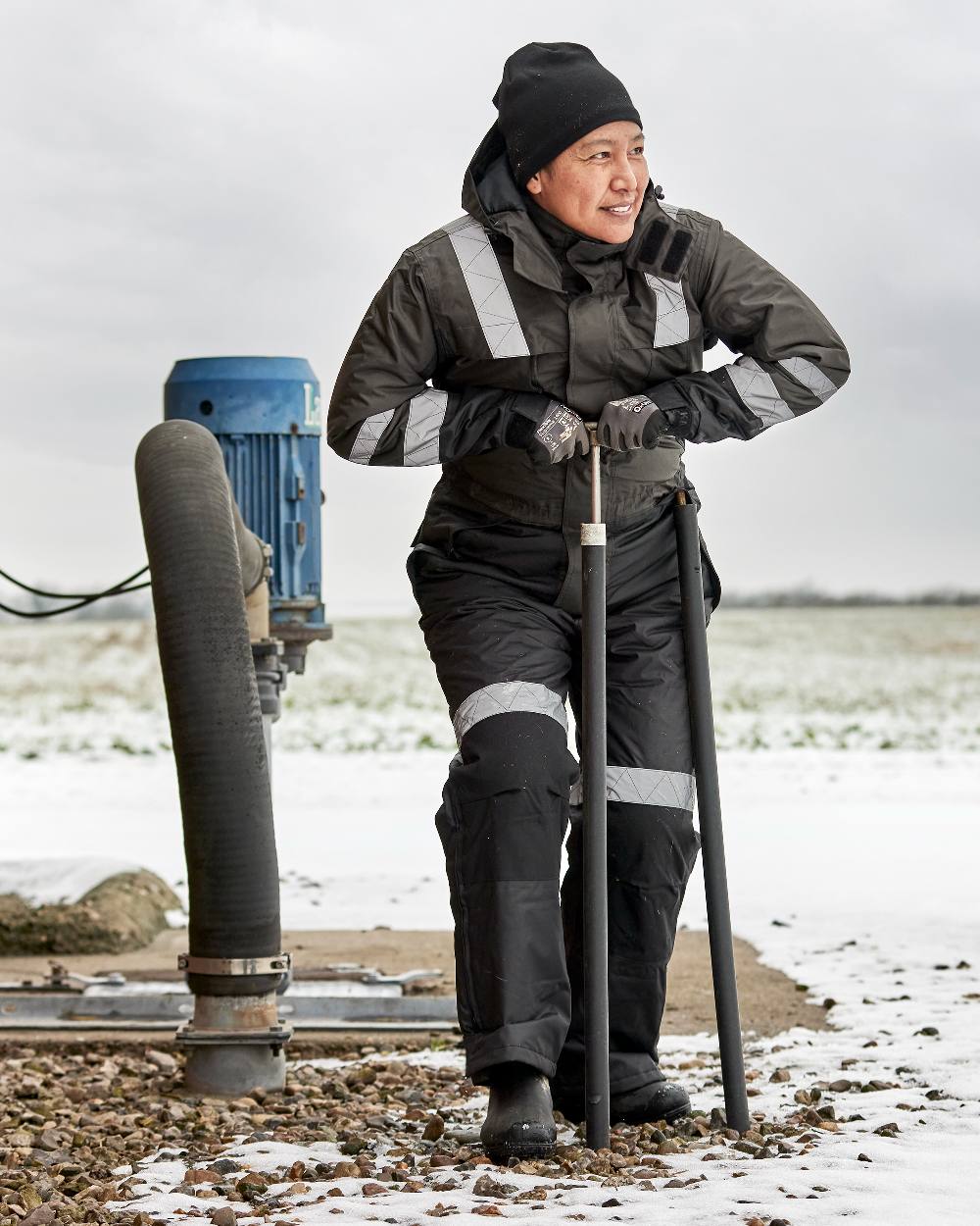 Grey Black Coloured Elka Womens Working Xtreme Winter Thermal Coverall on snow background 