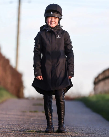 Black coloured Equidry Childrens Bronte Riding Coat on street background 