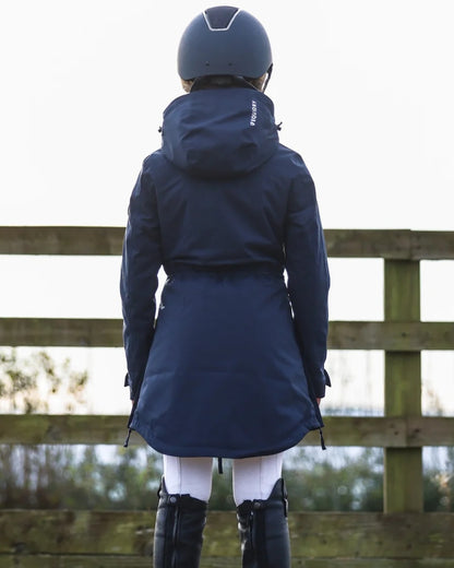 Navy coloured Equidry Childrens Bronte Riding Coat on outdoor background 