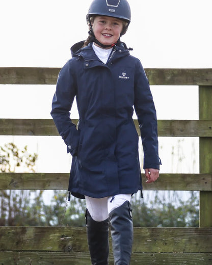 Navy coloured Equidry Childrens Bronte Riding Coat on outdoor background 