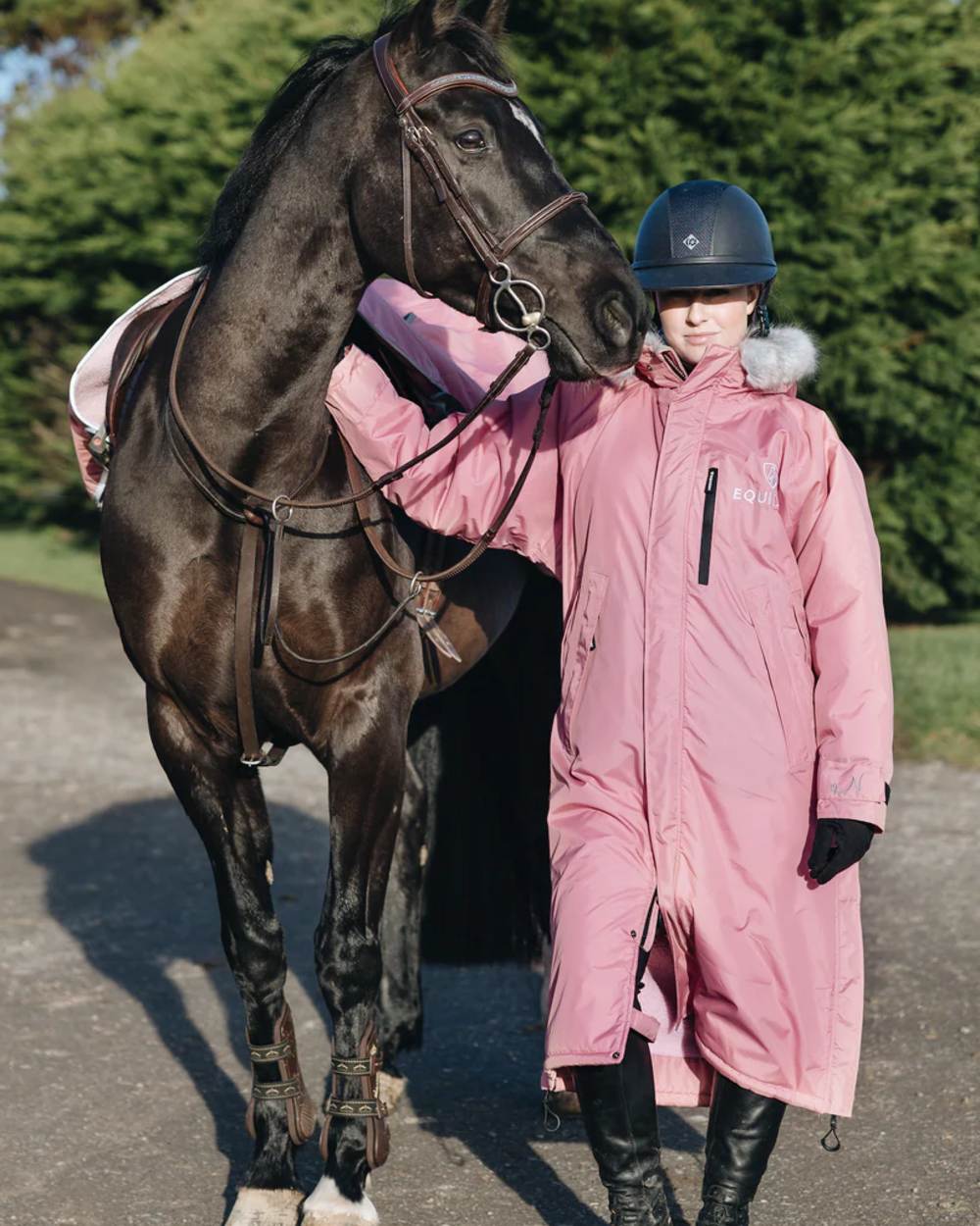 Dusky Pink coloured Equidry Childrens Evolution Thick Fleece With Fur Hood on tree background 