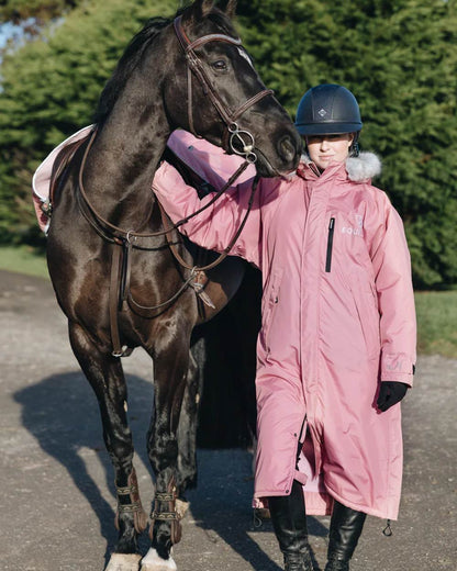 Dusky Pink coloured Equidry Childrens Evolution Thick Fleece With Fur Hood on tree background 