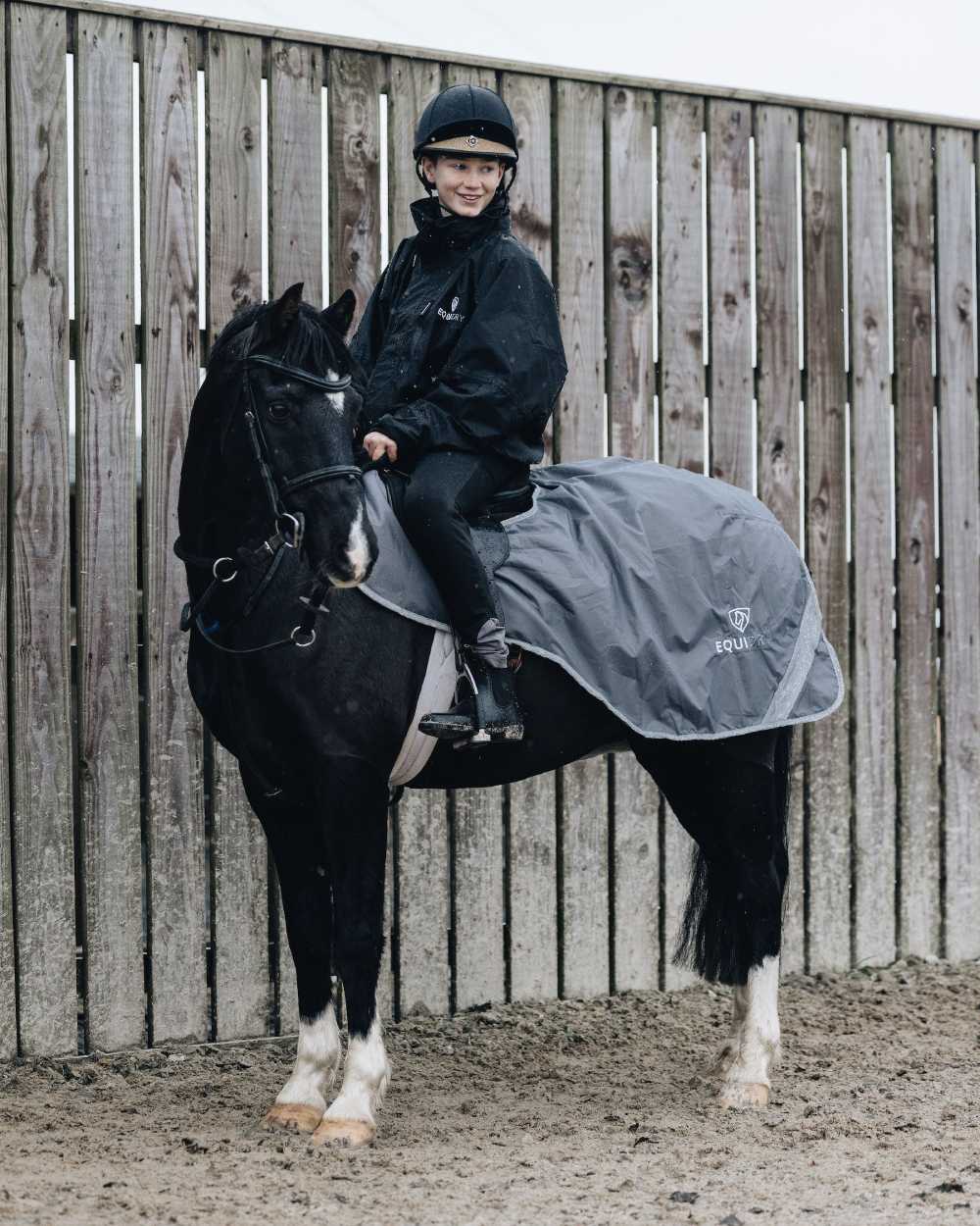 Black Forest Green coloured Equidry Childrens Shortie Jacket on stable background 