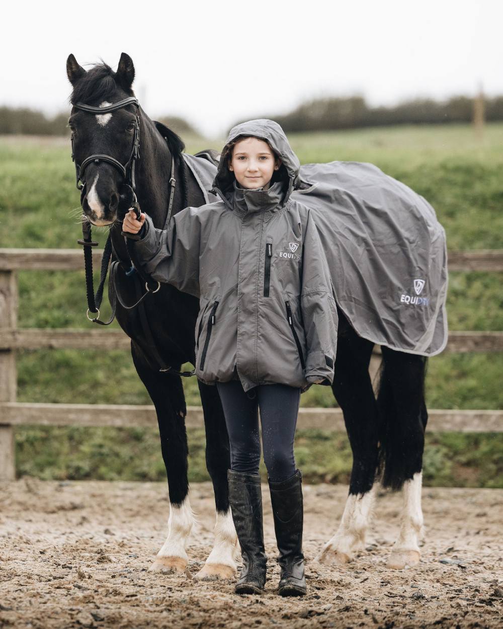 Charcoal Grey coloured Equidry Childrens Shortie Jacket on farm background 