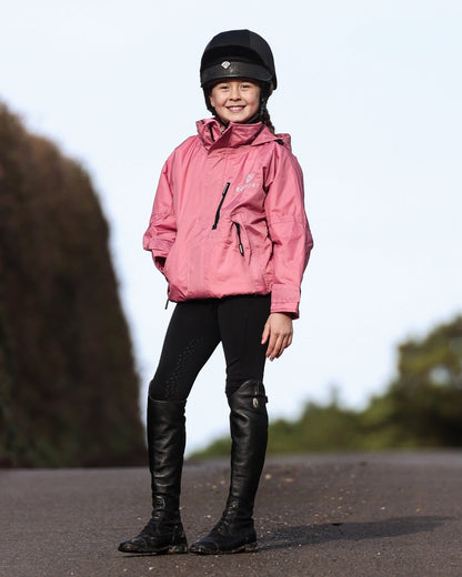 Dusky Pink coloured Equidry Childrens Shortie Jacket on street background 