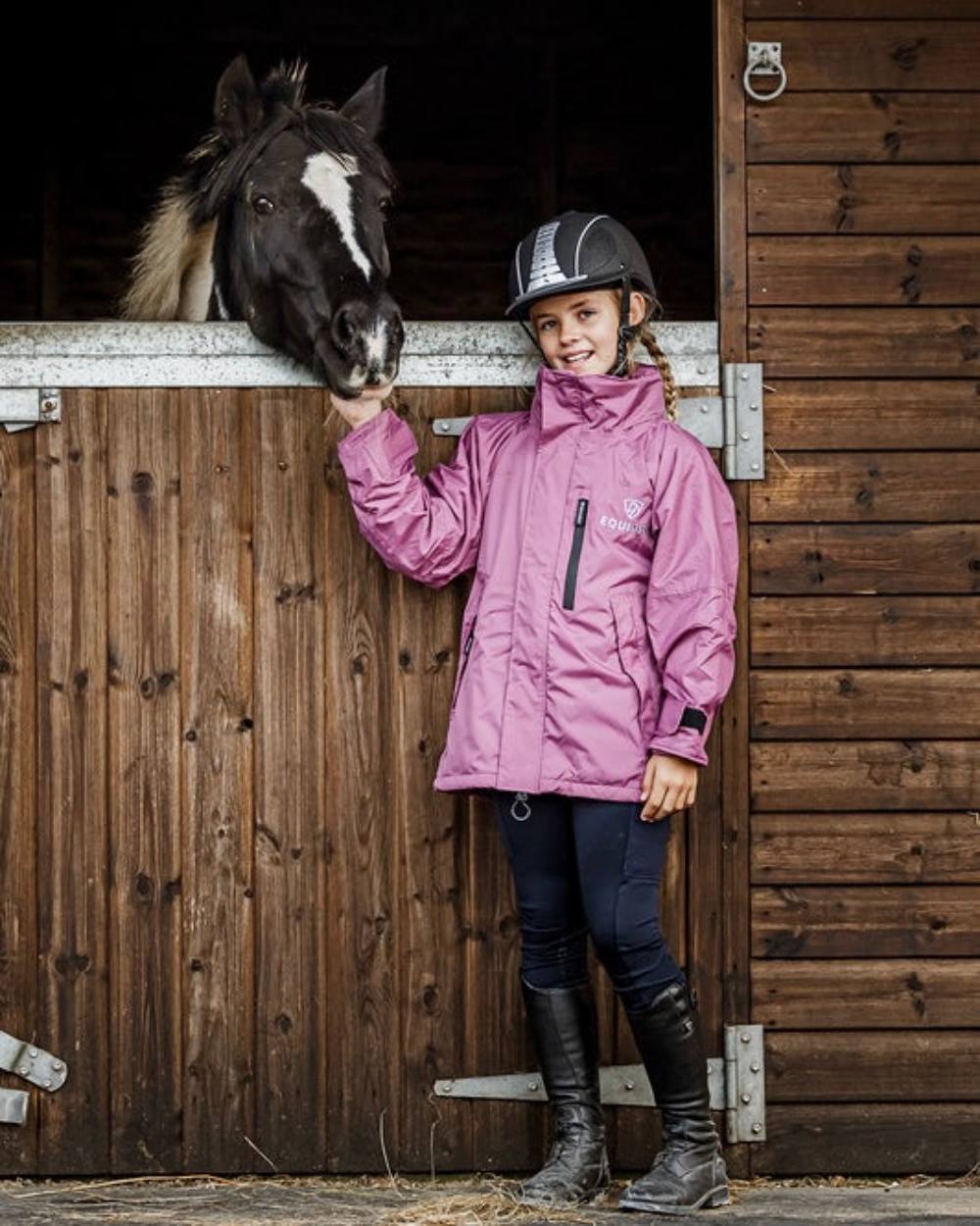 Rich Valerian coloured Equidry Childrens Shortie Jacket on stable background 
