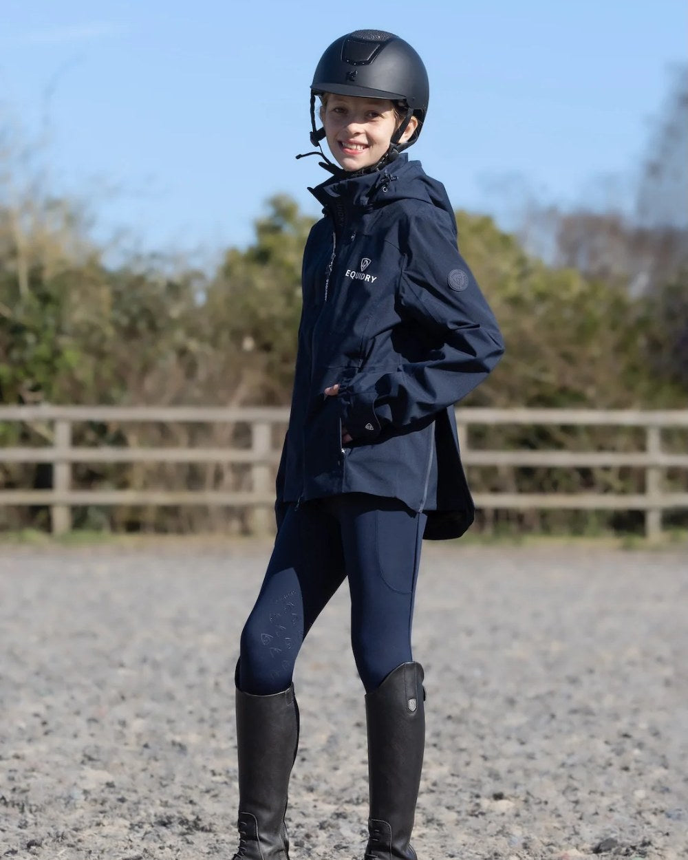 Navy Equidry Childrens Varsha Waterproof Jacket on outdoor background 