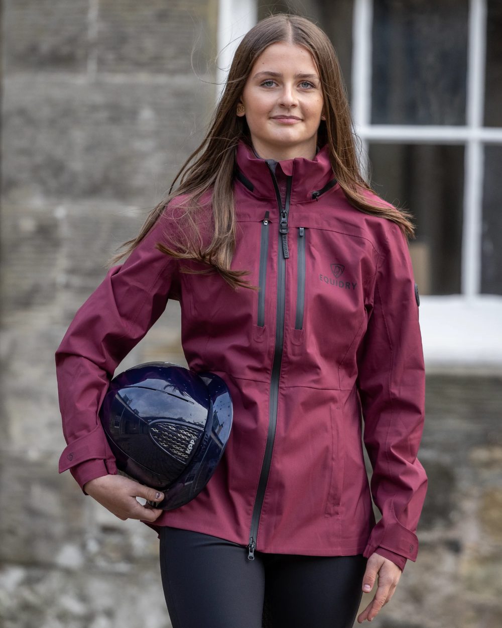 Plum Equidry Childrens Varsha Waterproof Jacket on outdoor background 
