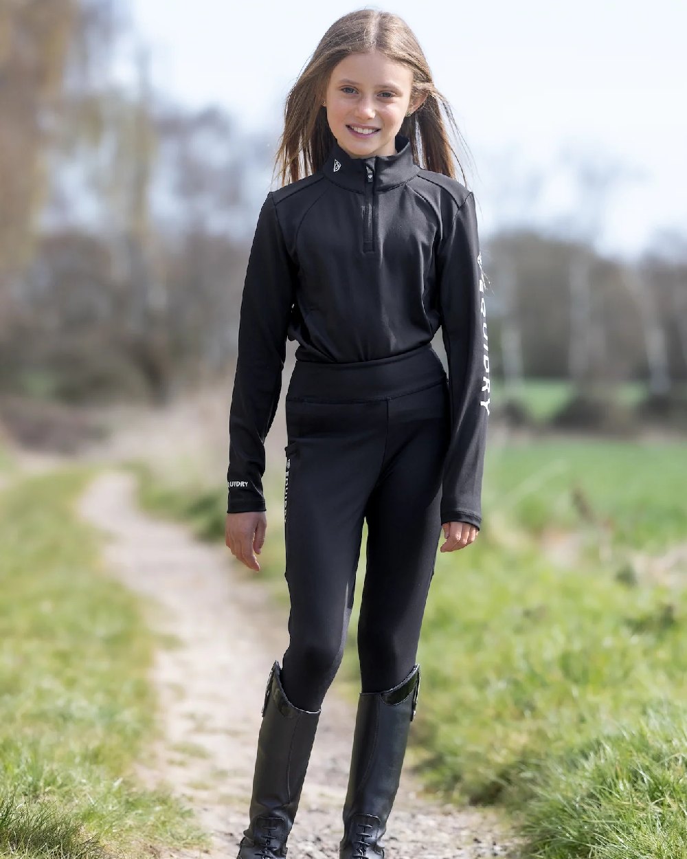 Black White Coloured Equidry Childrens Water Repellent Base Layer on outdoor background 