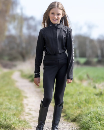 Black White Coloured Equidry Childrens Water Repellent Base Layer on outdoor background 