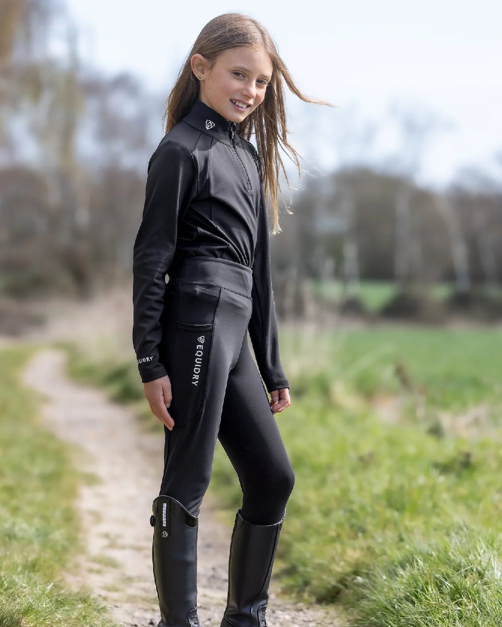Black White Coloured Equidry Childrens Water Repellent Base Layer on outdoor background 