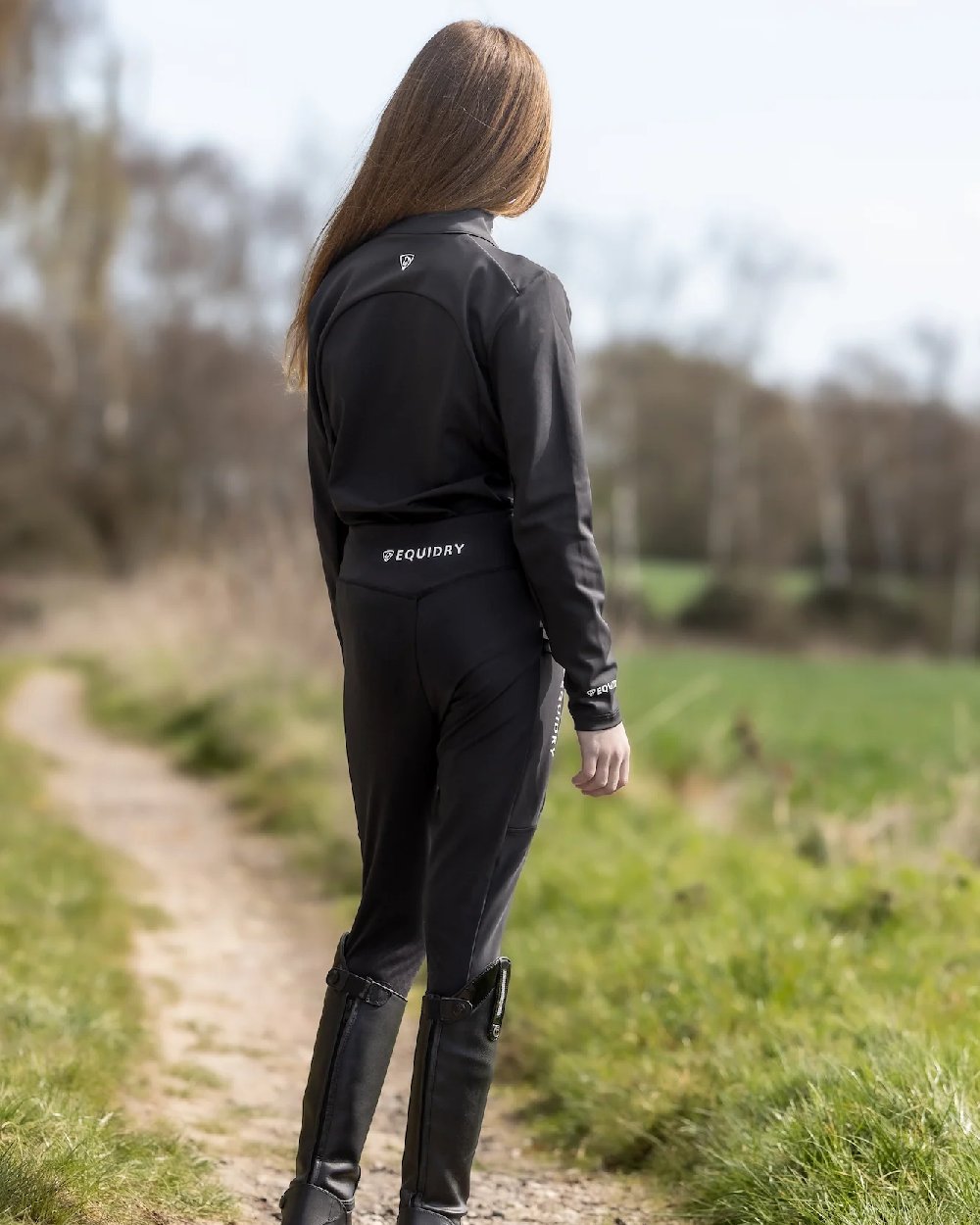 Black White Coloured Equidry Childrens Water Repellent Base Layer on outdoor background 