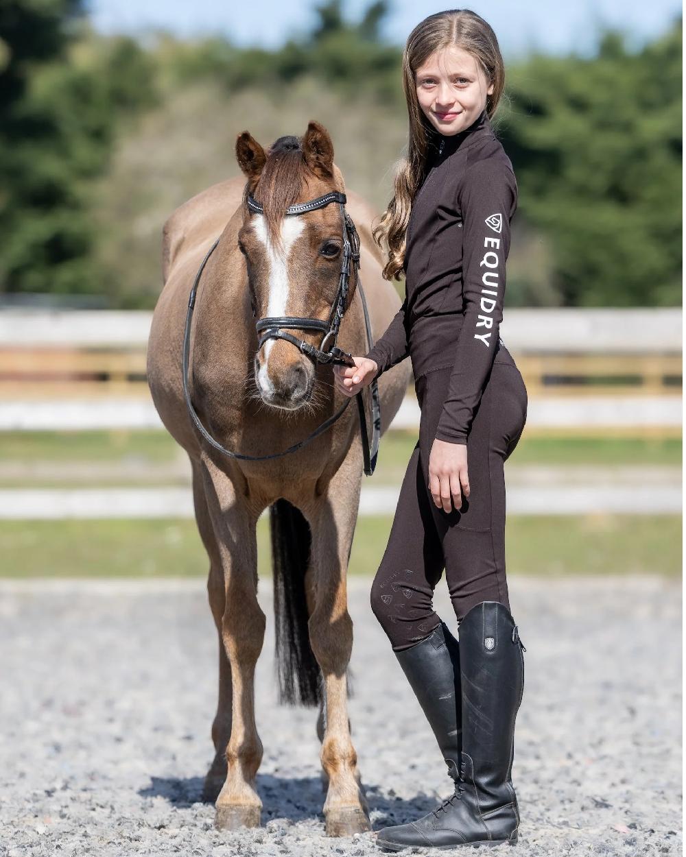 Brown White Coloured Equidry Childrens Water Repellent Base Layer on outdoor background 