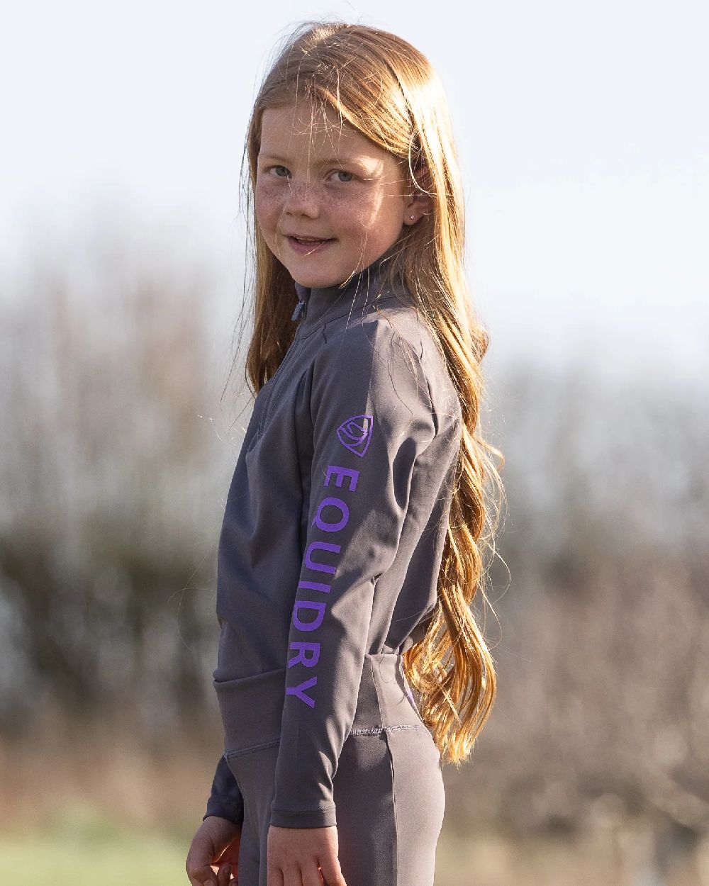 Grey Lilac Coloured Equidry Childrens Water Repellent Base Layer on outdoor background 