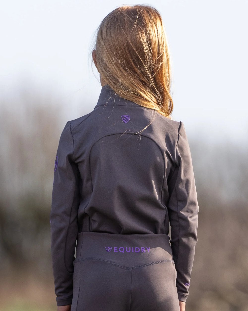 Grey Lilac Coloured Equidry Childrens Water Repellent Base Layer on outdoor background 