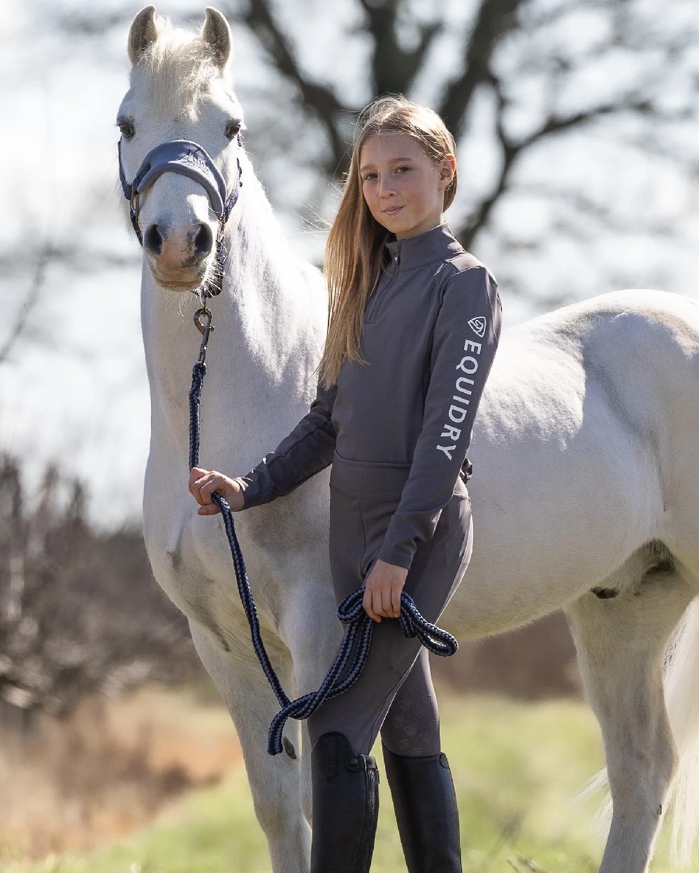 Grey White Coloured Equidry Childrens Water Repellent Base Layer on outdoor background 