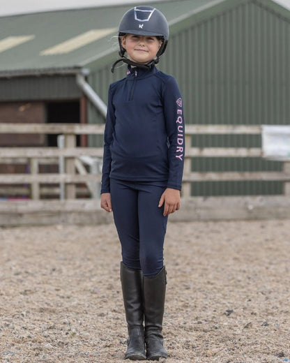 Navy Pale Pink Coloured Equidry Childrens Water Repellent Base Layer on outdoor background 