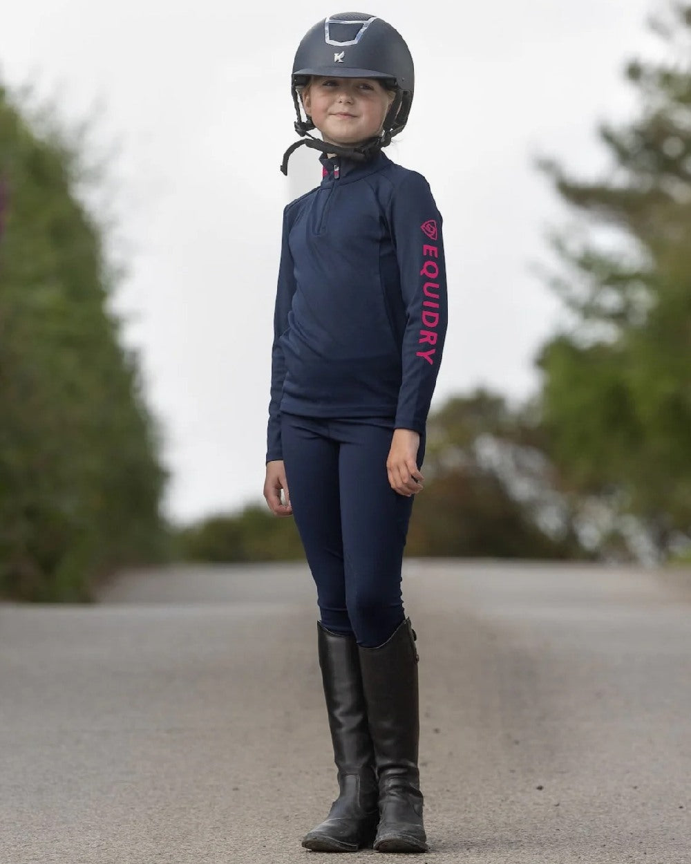 Navy Raspberry Coloured Equidry Childrens Water Repellent Base Layer on outdoor background 