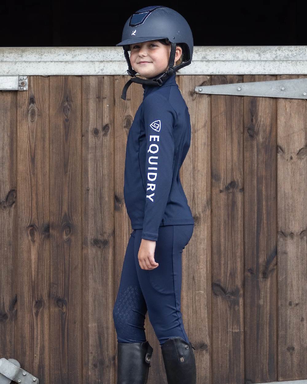 Navy White Coloured Equidry Childrens Water Repellent Base Layer on outdoor background 