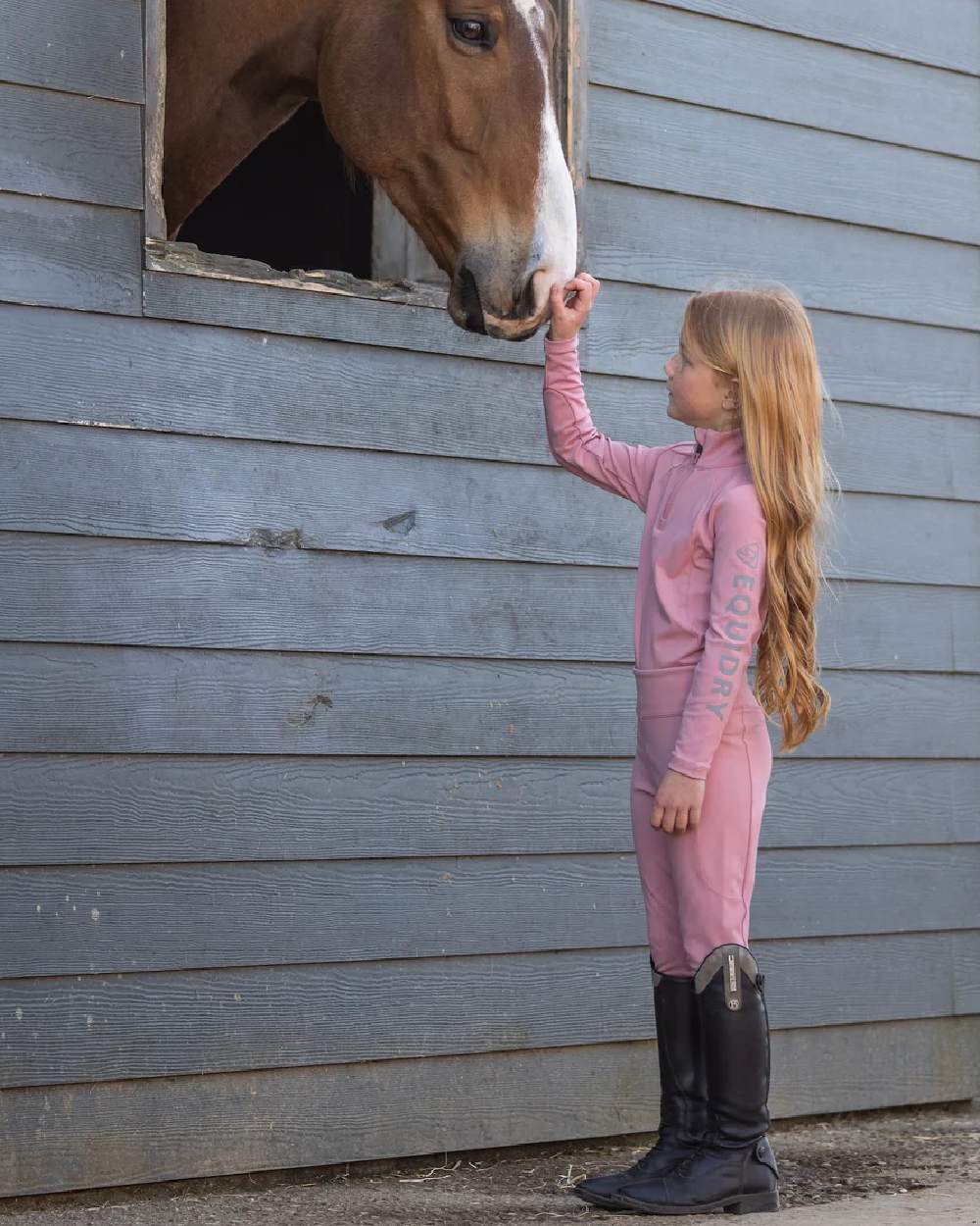 Pale Pink Grey Coloured Equidry Childrens Water Repellent Base Layer on outdoor background 