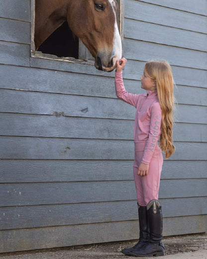 Pale Pink Grey Coloured Equidry Childrens Water Repellent Base Layer on outdoor background 