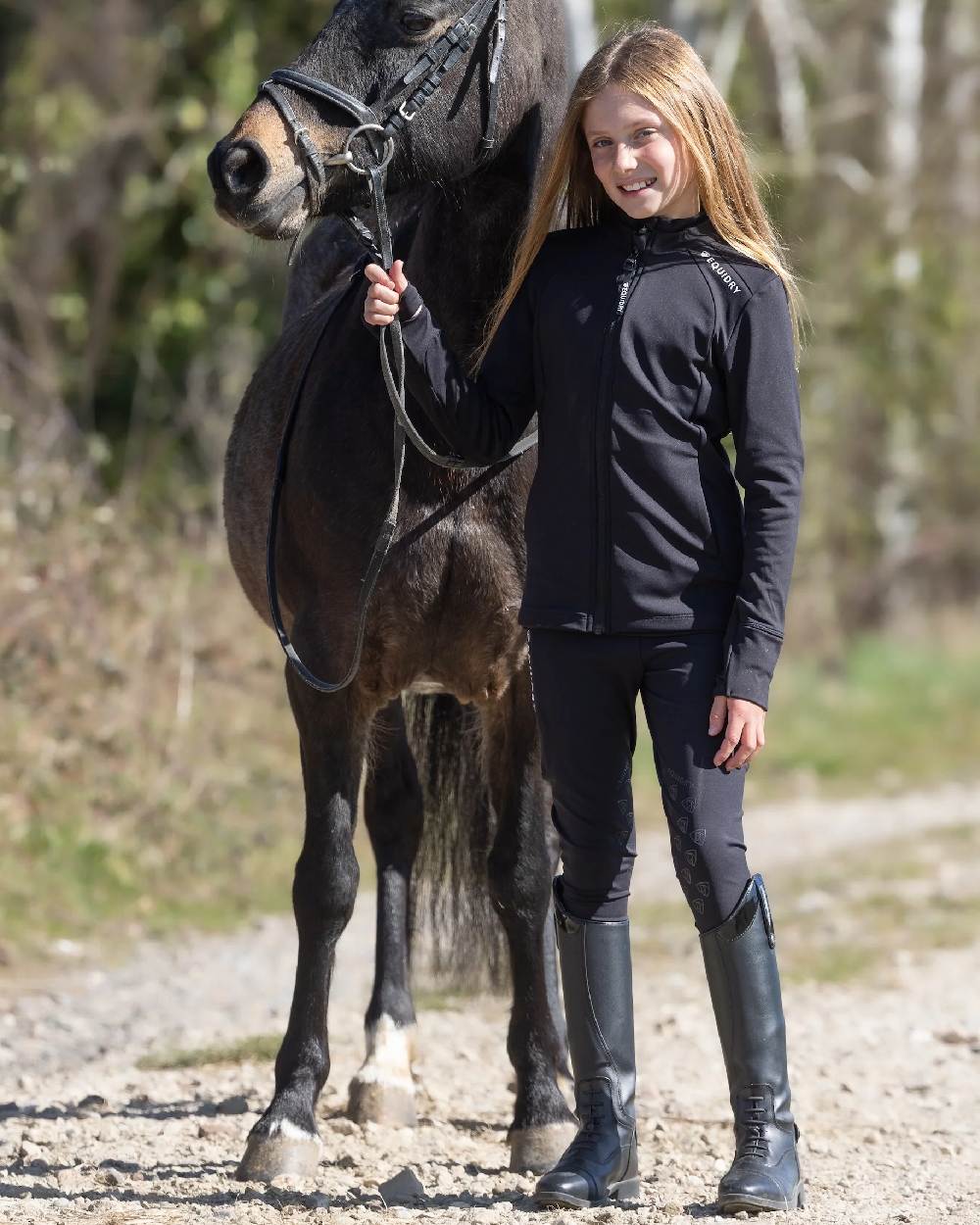 Black White Coloured Equidry Childrens Water Repellent Knee Grip Leggings on outdoor background 