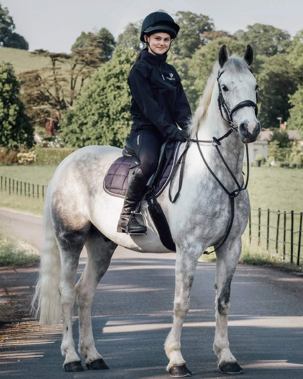 Black White Coloured Equidry Childrens Water Repellent Knee Grip Leggings on outdoor background 