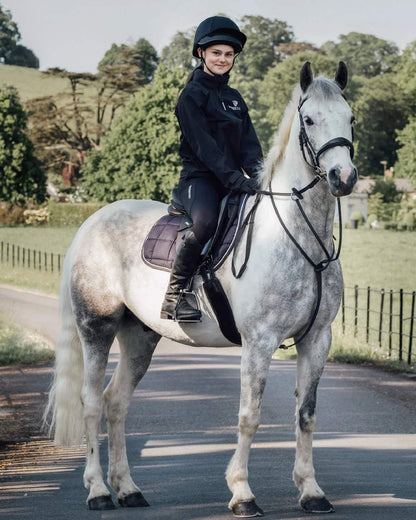 Black White Coloured Equidry Childrens Water Repellent Knee Grip Leggings on outdoor background 