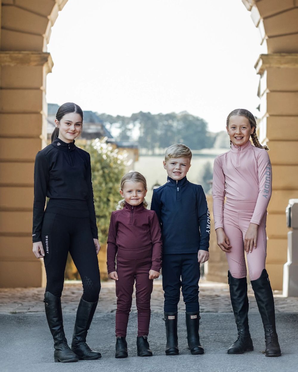 Black White Coloured Equidry Childrens Water Repellent Knee Grip Leggings on outdoor background 