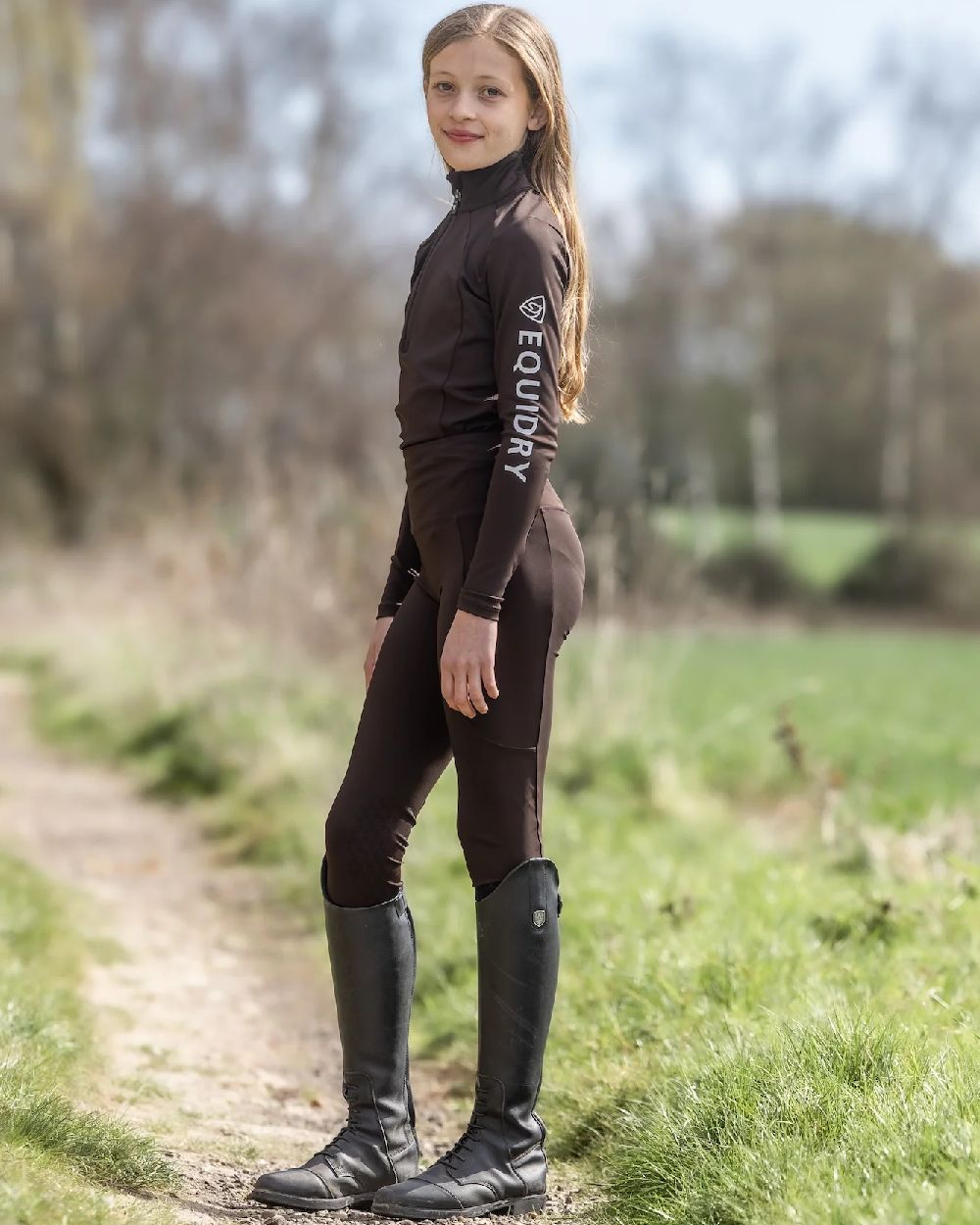Brown White Coloured Equidry Childrens Water Repellent Knee Grip Leggings on outdoor background 