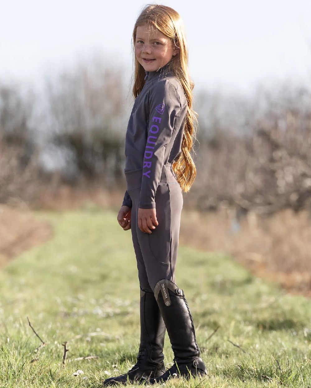 Grey Lilac Coloured Equidry Childrens Water Repellent Knee Grip Leggings on outdoor background 