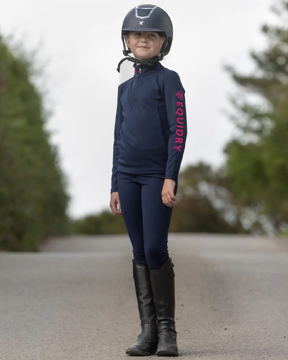 Navy Raspberry Coloured Equidry Childrens Water Repellent Knee Grip Leggings on outdoor background 