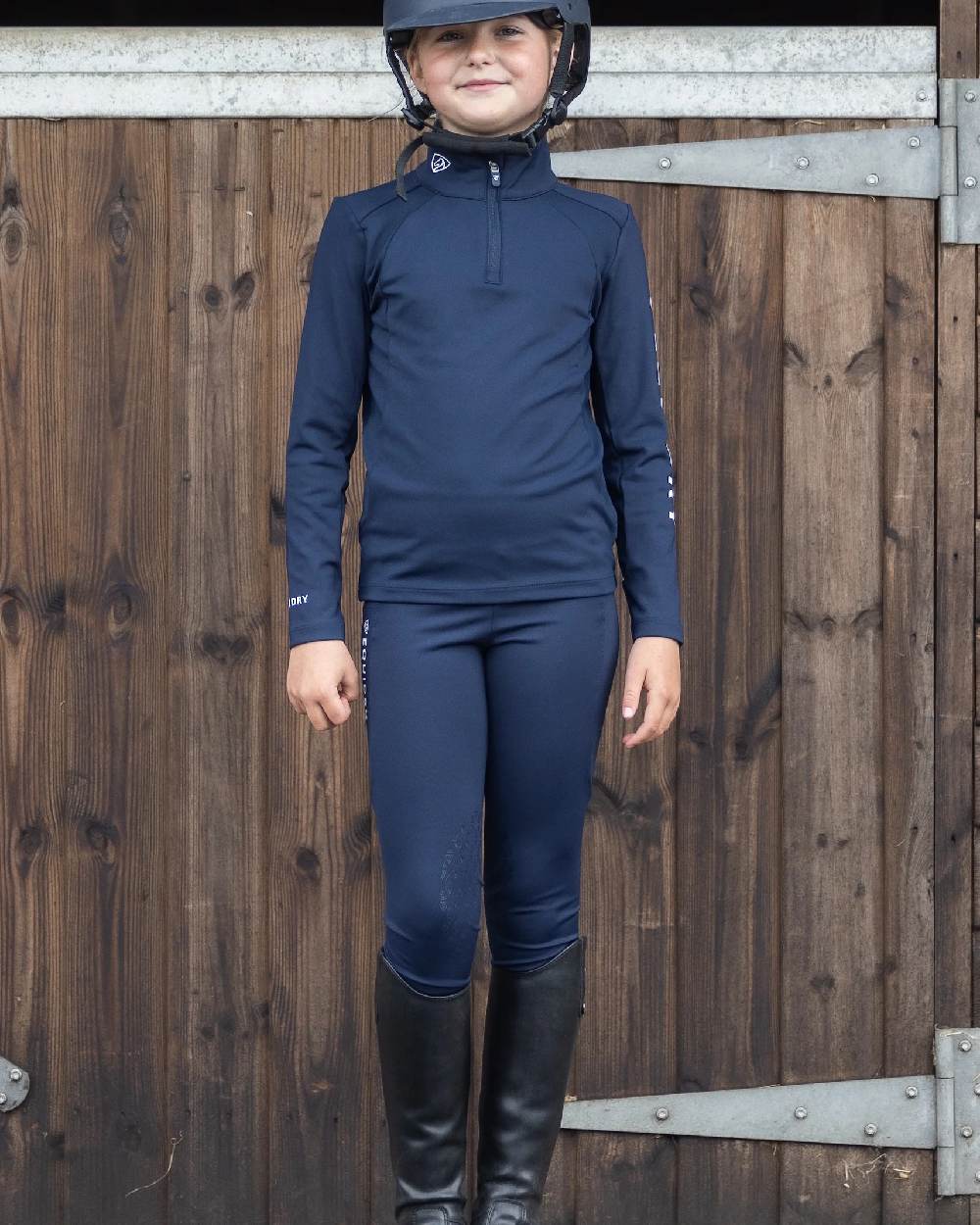 Navy White Coloured Equidry Childrens Water Repellent Knee Grip Leggings on outdoor background 