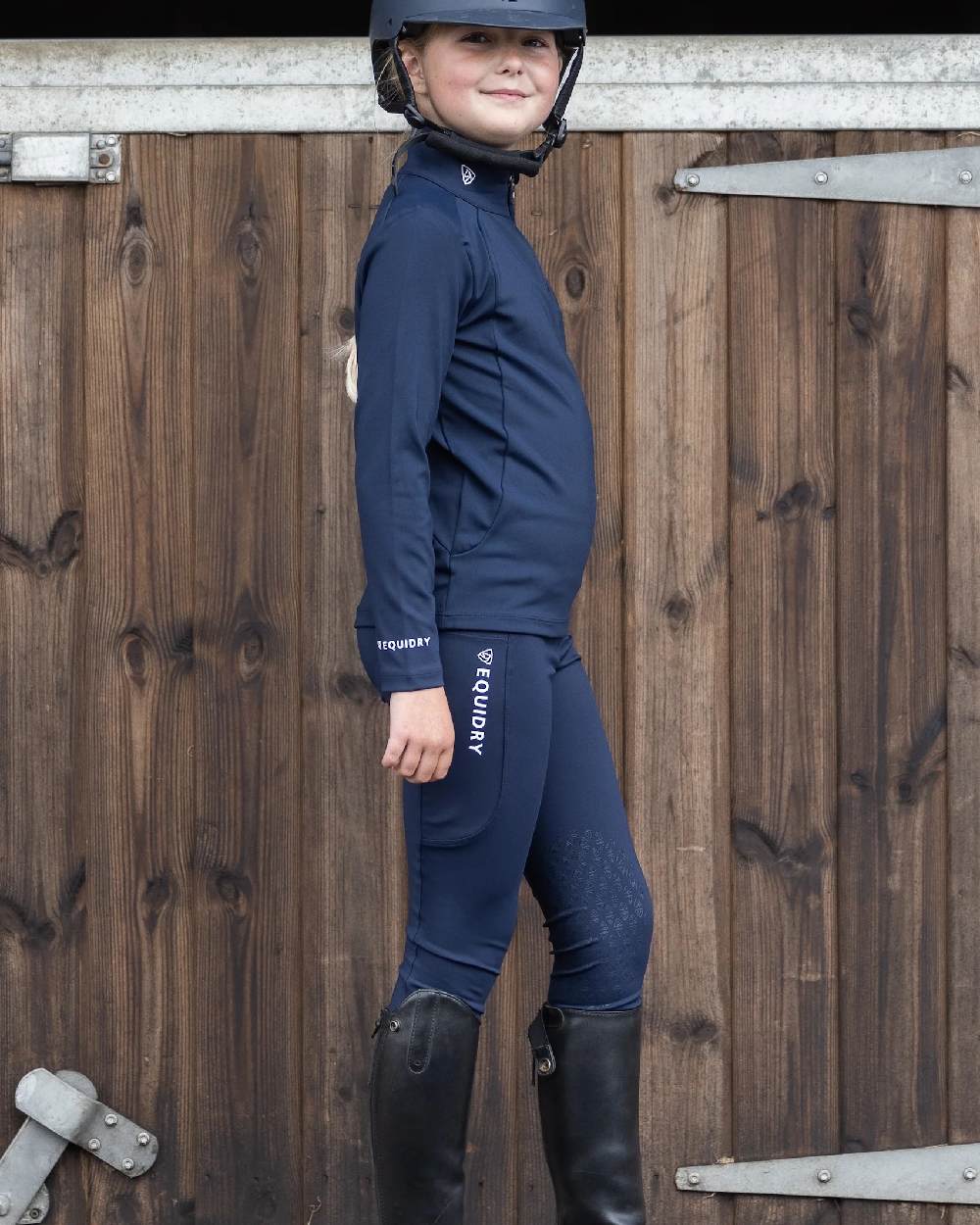 Navy White Coloured Equidry Childrens Water Repellent Knee Grip Leggings on outdoor background 