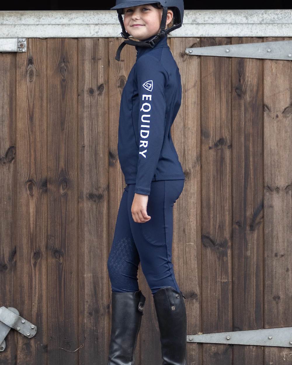 Navy White Coloured Equidry Childrens Water Repellent Knee Grip Leggings on outdoor background 