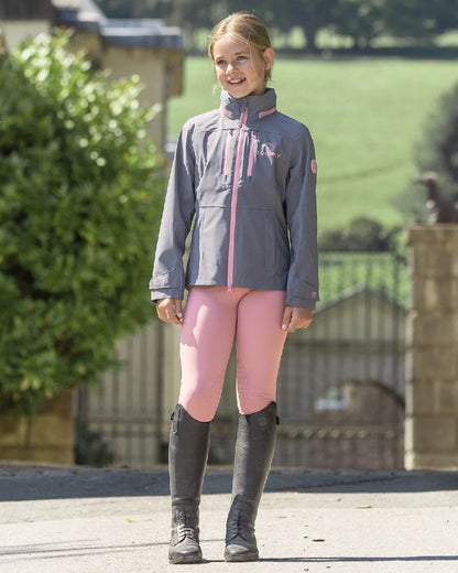 Pale Pink Grey Coloured Equidry Childrens Water Repellent Knee Grip Leggings on outdoor background 