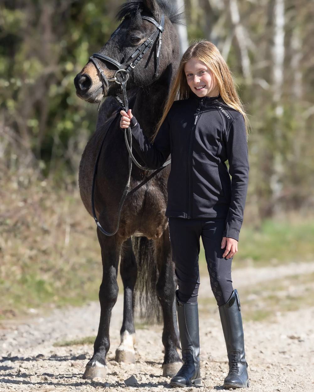 Black White Coloured Equidry Childrens Water Repellent Zip Up Top on outdoor background 