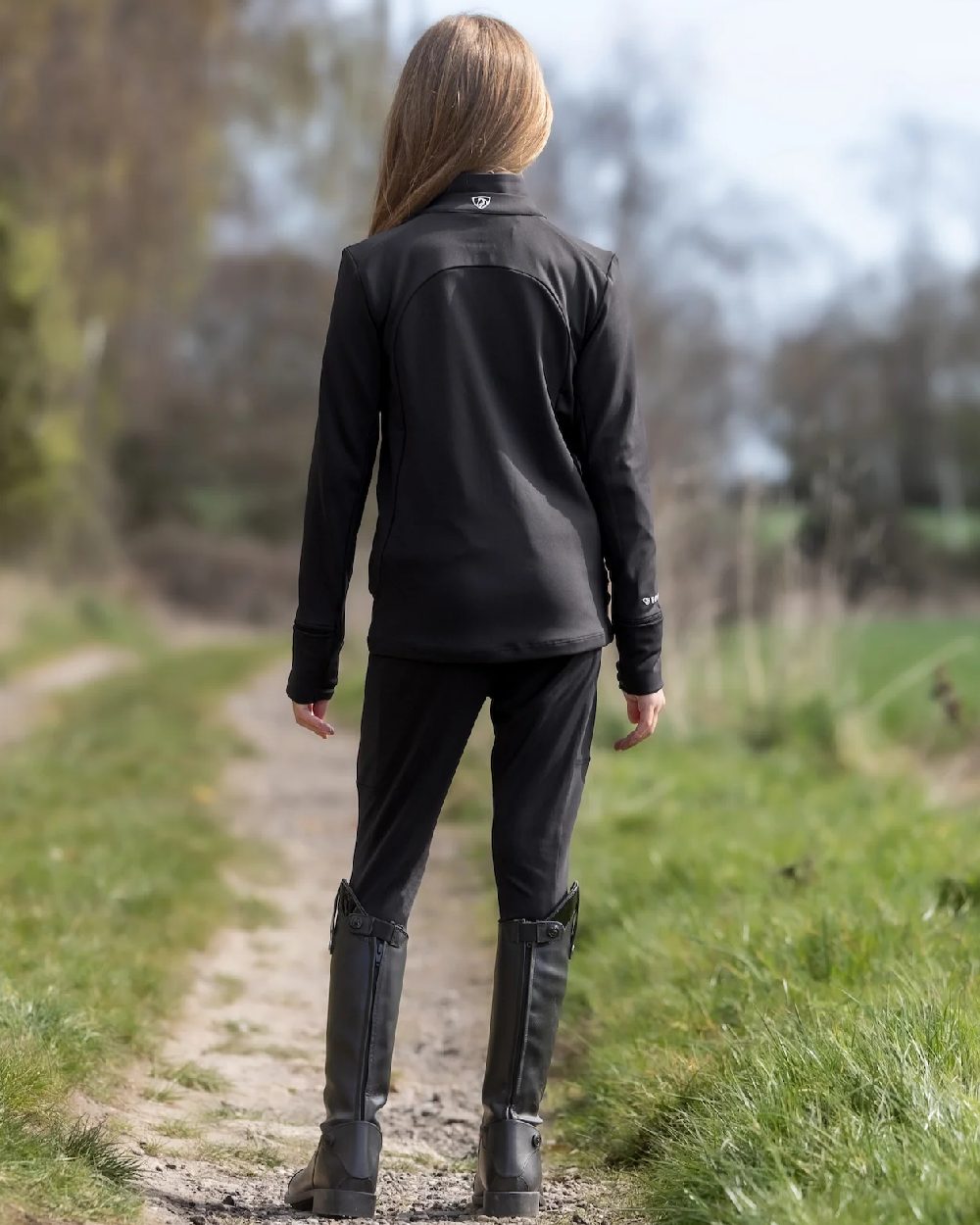 Black White Coloured Equidry Childrens Water Repellent Zip Up Top on outdoor background 