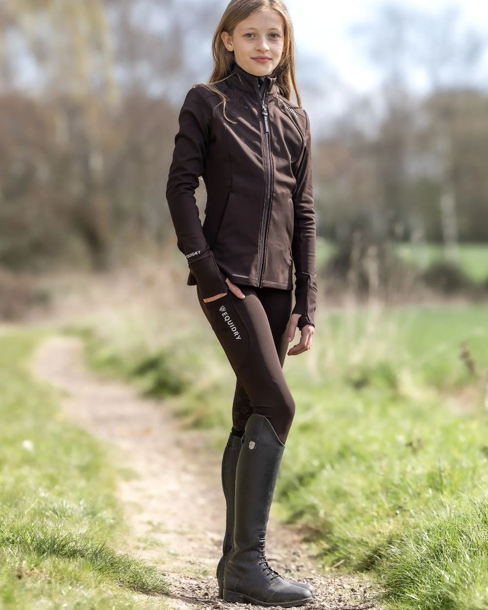 Brown White Coloured Equidry Childrens Water Repellent Zip Up Top on outdoor background 