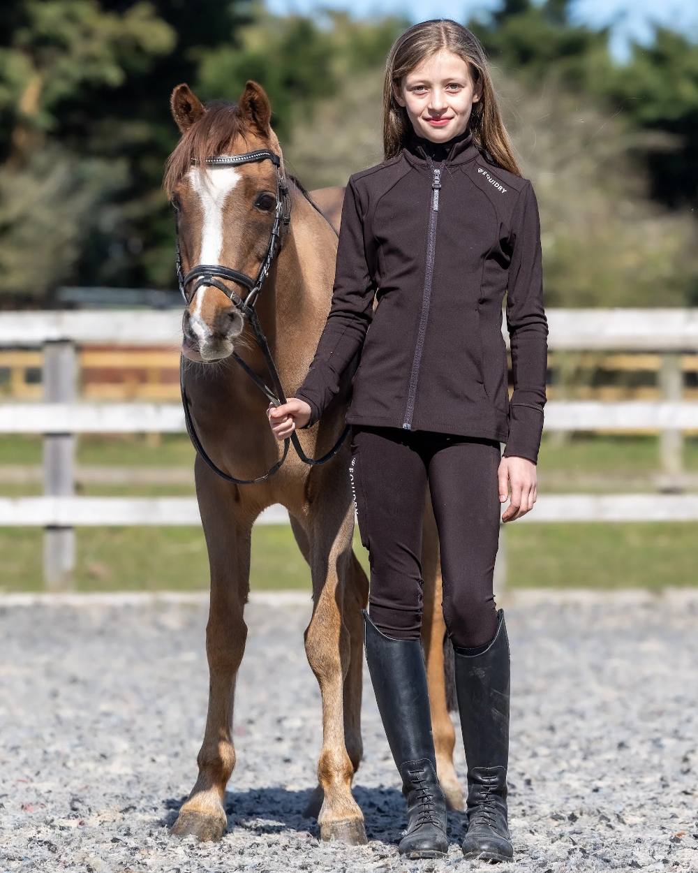 Brown White Coloured Equidry Childrens Water Repellent Zip Up Top on outdoor background 