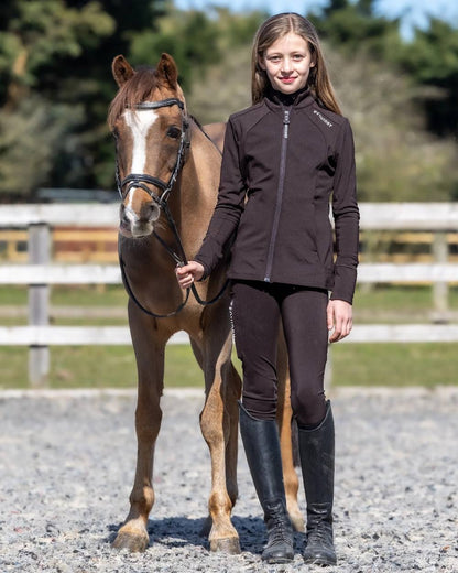 Brown White Coloured Equidry Childrens Water Repellent Zip Up Top on outdoor background 