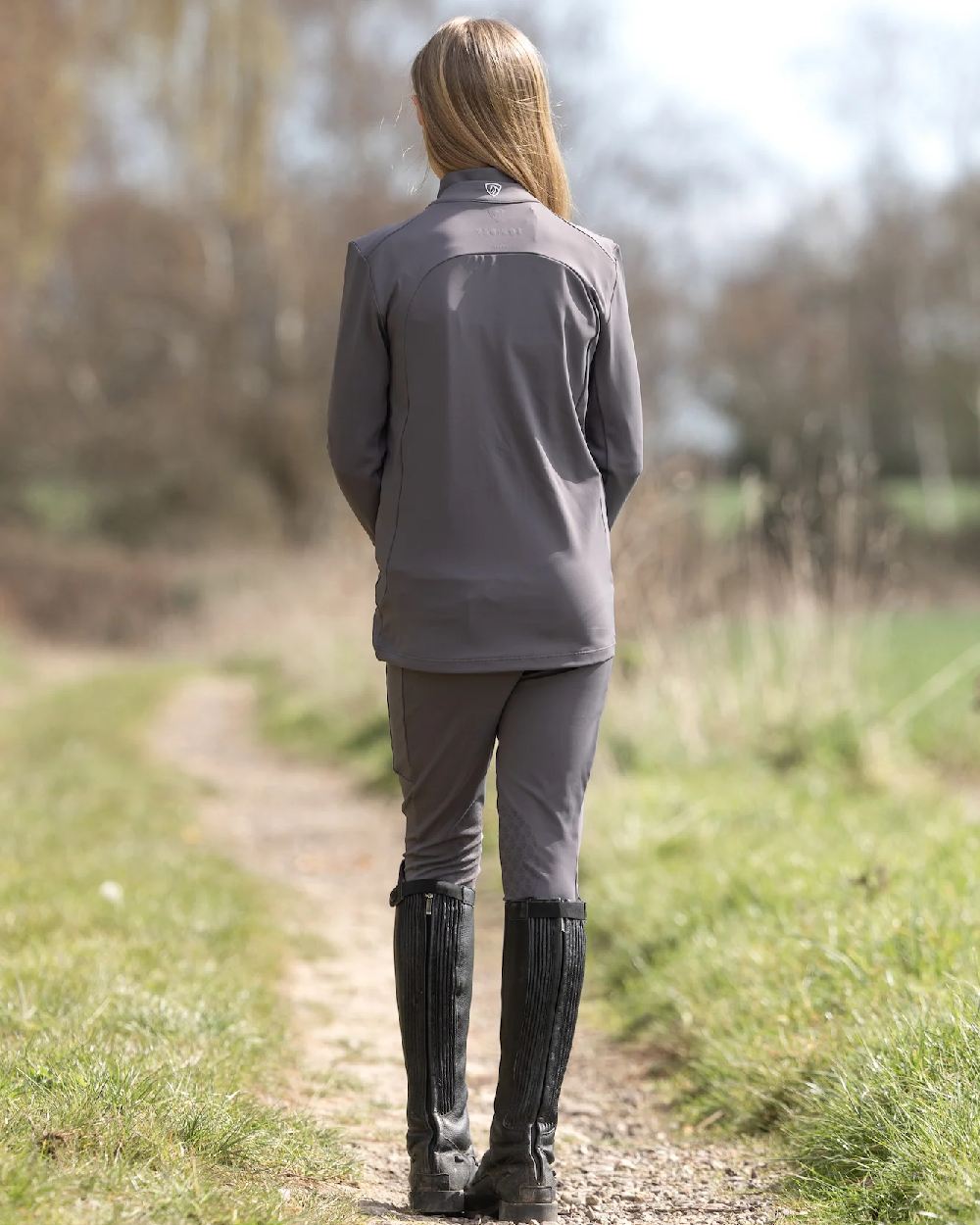 Grey White Coloured Equidry Childrens Water Repellent Zip Up Top on outdoor background 