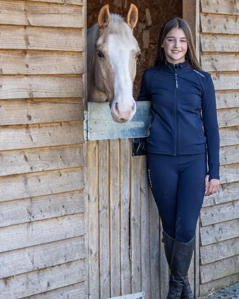 Navy White Coloured Equidry Childrens Water Repellent Zip Up Top on outdoor background 