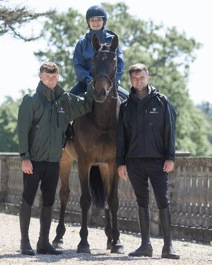 Black coloured Equidry Mens Equimac Shortie With Stowaway Hood on outdoor background 