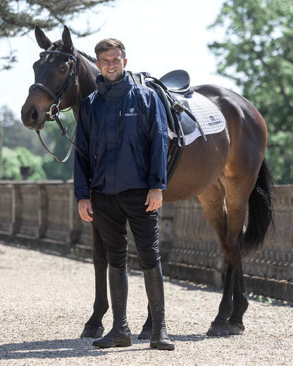 Navy coloured Equidry Mens Equimac Shortie With Stowaway Hood on outdoor background 