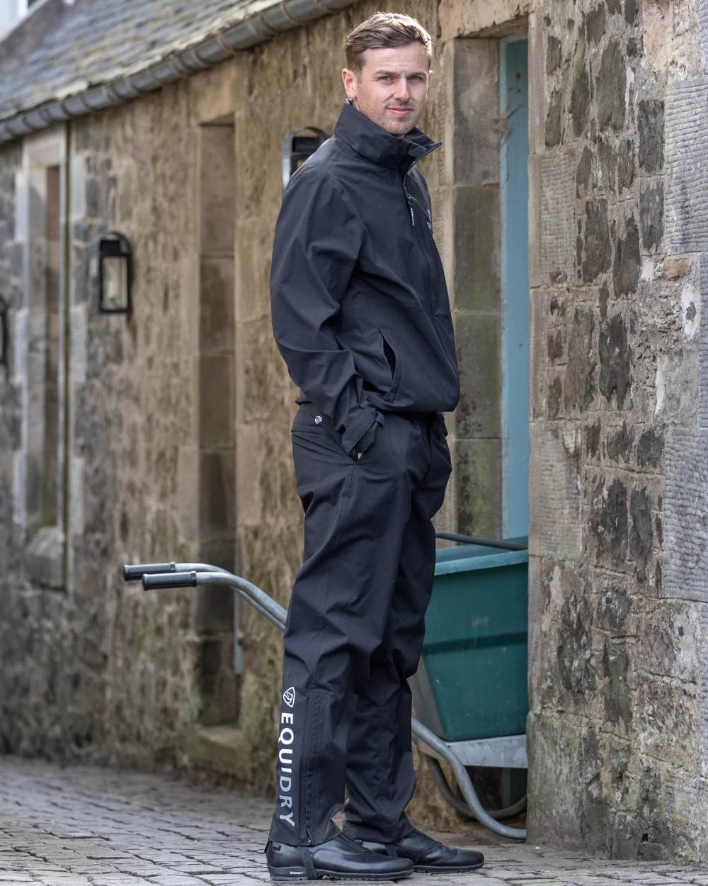 Black coloured Equidry Mens Fleece Lined Waterproof Trousers on outdoor background 