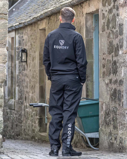 Black coloured Equidry Mens Fleece Lined Waterproof Trousers on outdoor background 